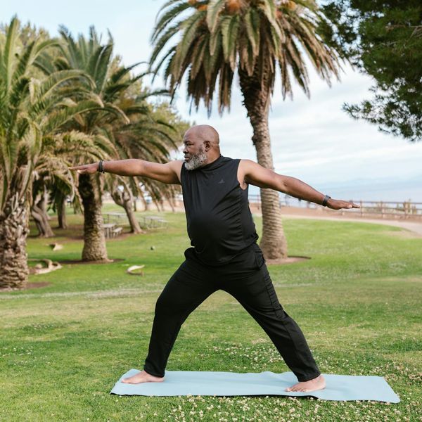 Person standing in a balanced yoga pose, symbolizing stability and calm.